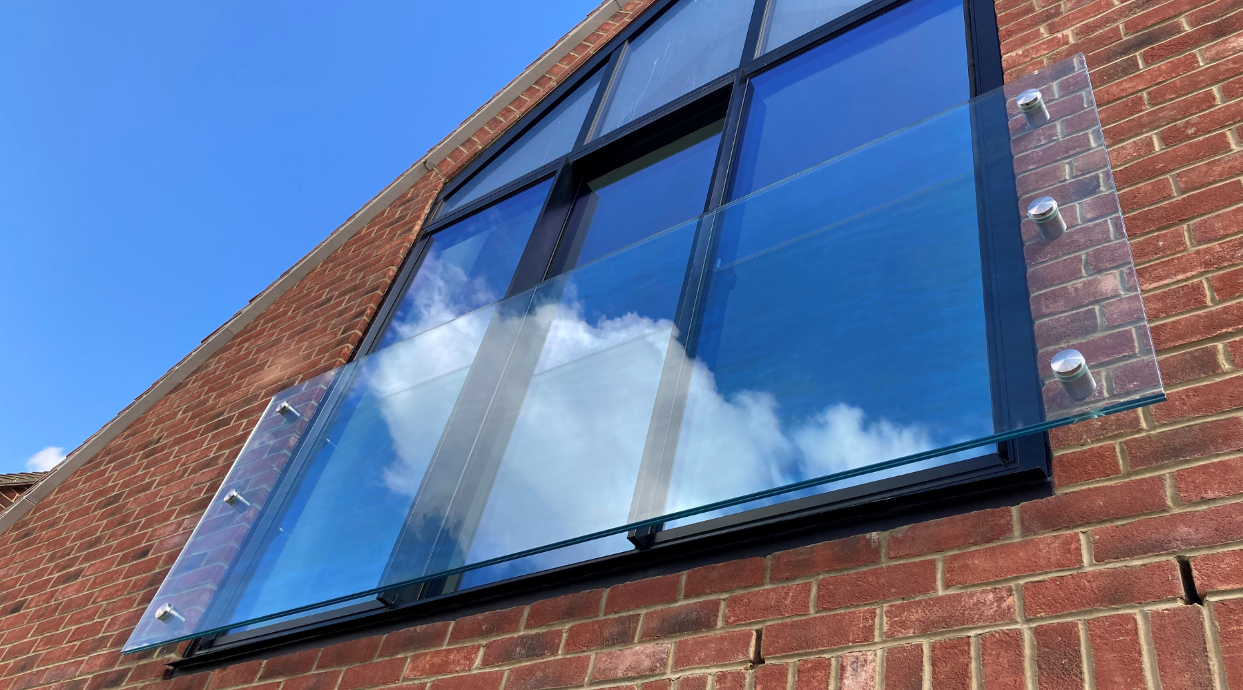 Toughened laminated glass juliet balcony with fittings