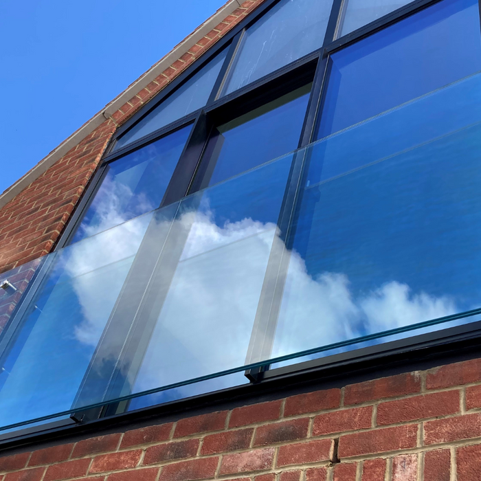Toughened laminated glass juliet balcony with fittings