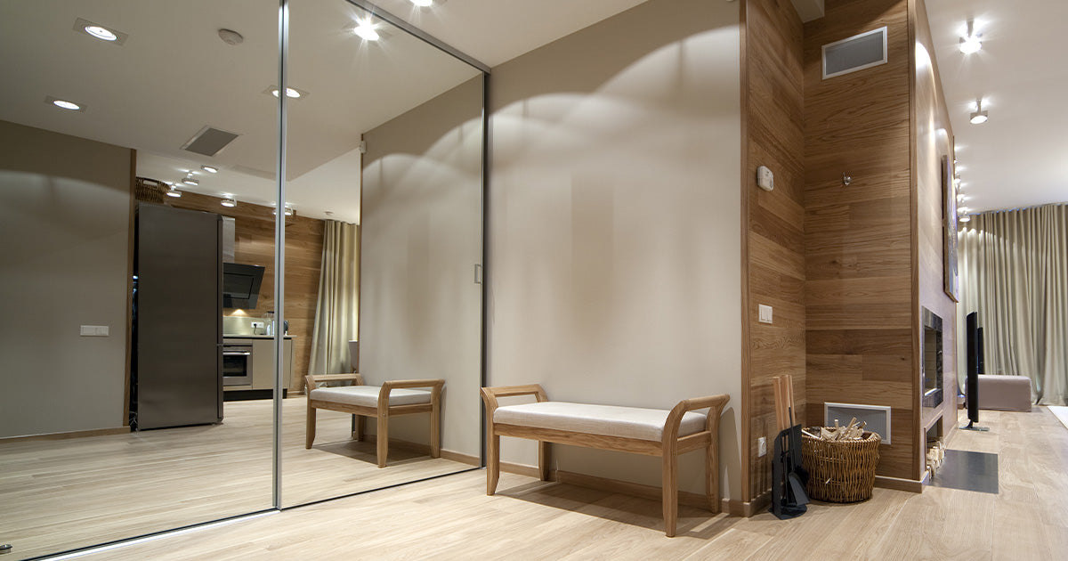 Floor to ceiling glass mirrors to create the illusion of more internal space