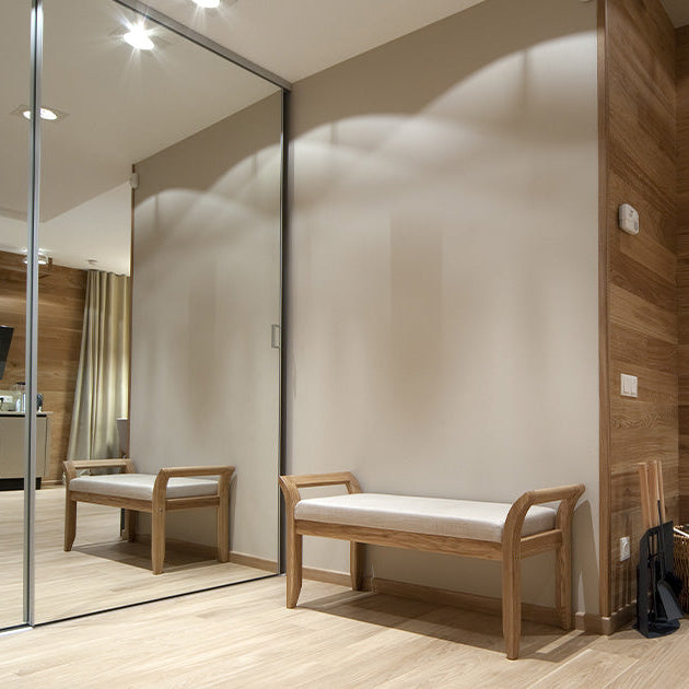 Floor to ceiling glass mirrors to create the illusion of more internal space